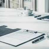 close-up-business-contract-paper-on-meeting-room-t-2026-01-06-08-54-51-utc 1