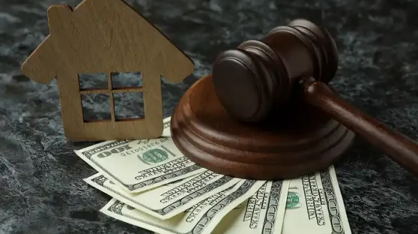 gavel-money-and-house-model-on-textured-backgroun-2026-03-24-22-42-06-utc 1